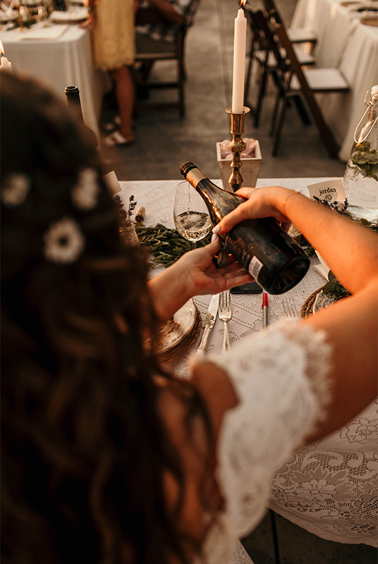 Bride pouring wine